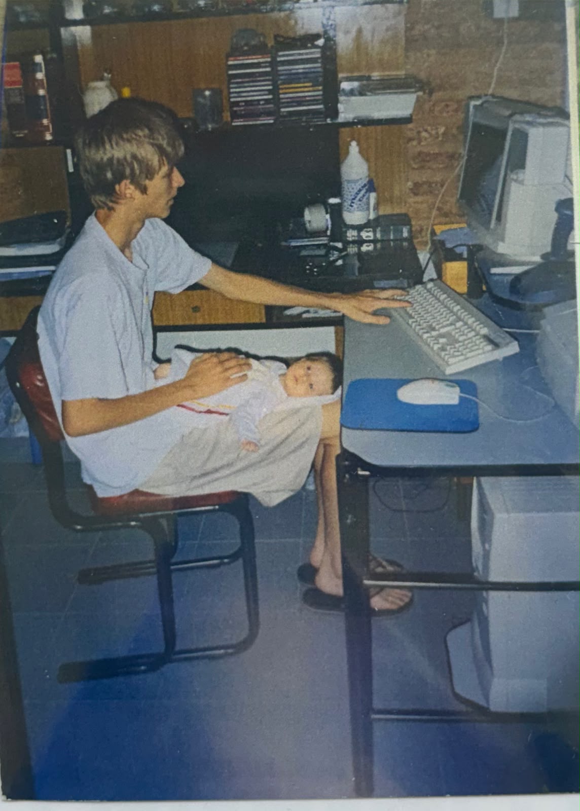 Baby MaVi with her brother at the computer, 2003