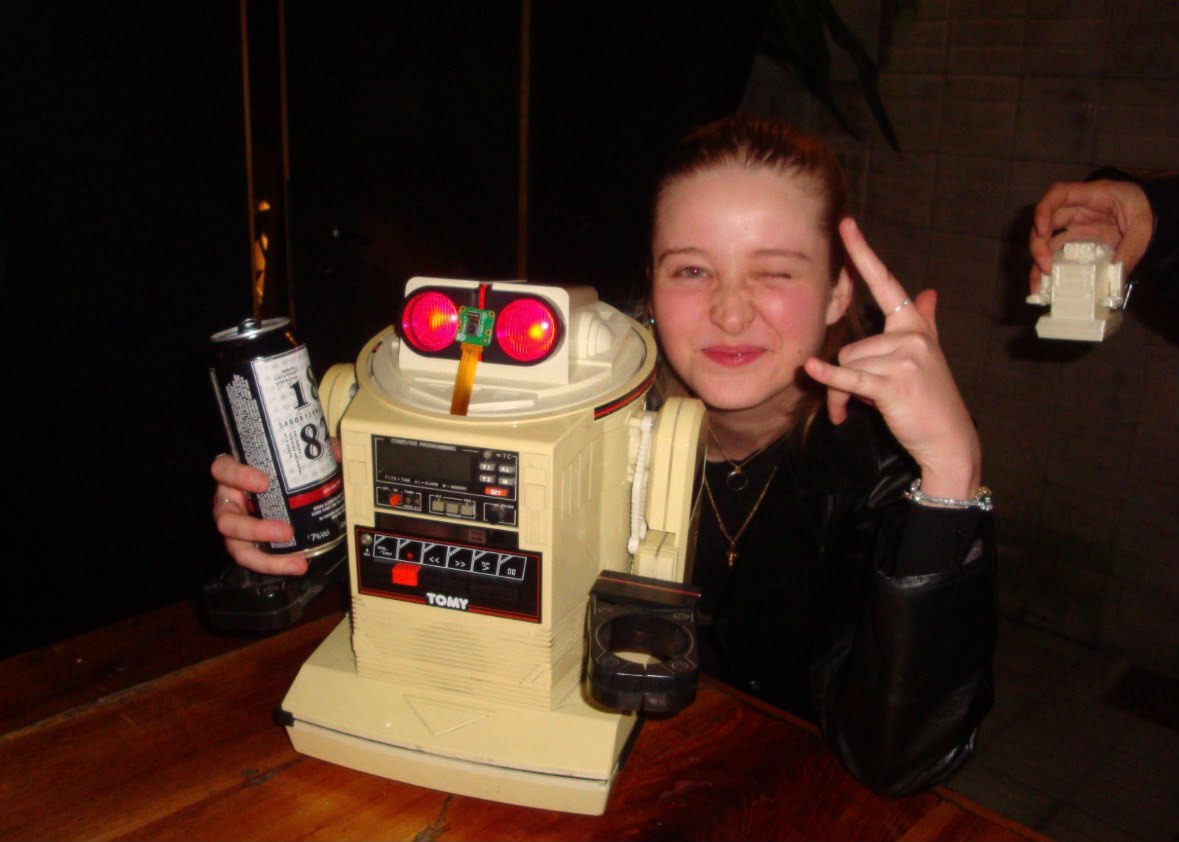 MaVi posing with a vintage TOMY Omnibot robot